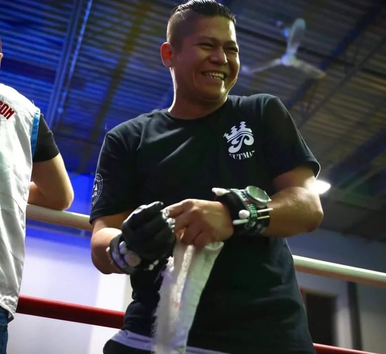 boxing coach philip smiling from the ring