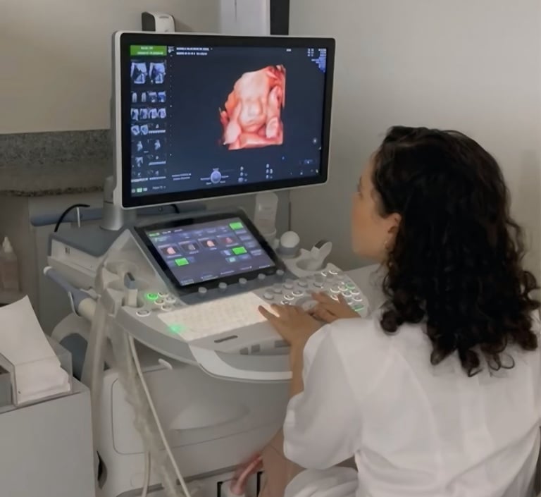 A female technician performs a 3D baby ultrasound using professional medical imaging equipment.