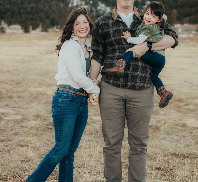Family portrait of the owner / operators of Peaks and Pines Cleaning Service: Johnathon and Sierra, with their baby Julia.