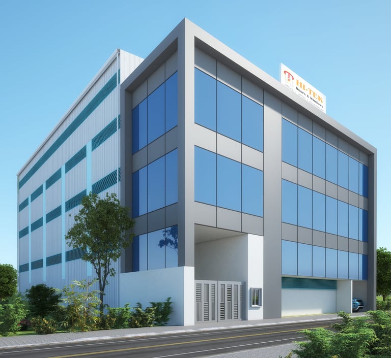 Modern Hi-Tek industrial building with blue glass windows and a sleek gray facade.