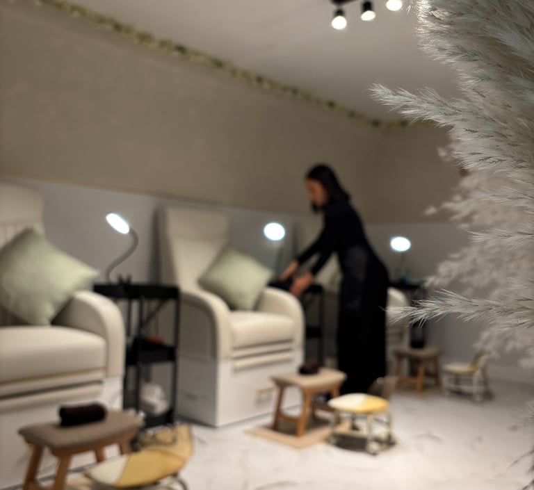 Image of the beauty studio seats, with a person preparing the seat