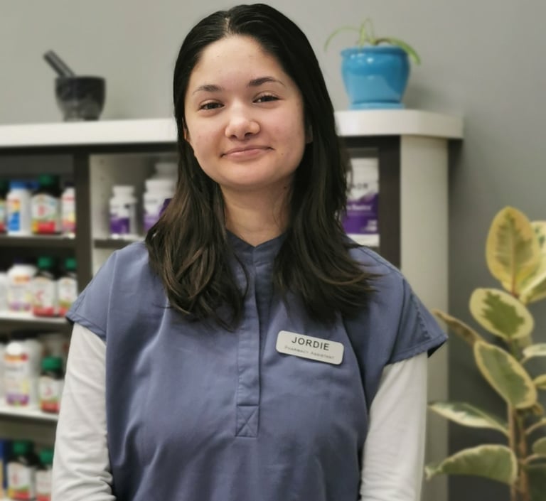 picture of woman with dark hair wearing blue scrubs