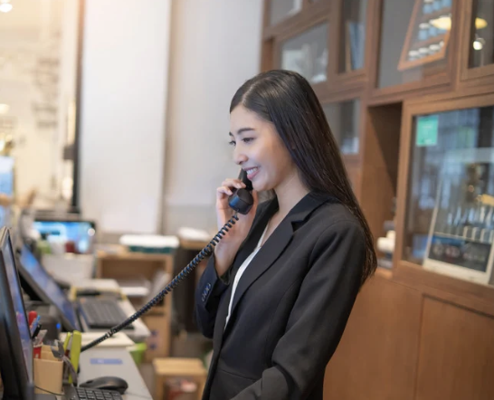 Concierge answering a guest call — part of Vision Immo Bali’s personalized villa management service