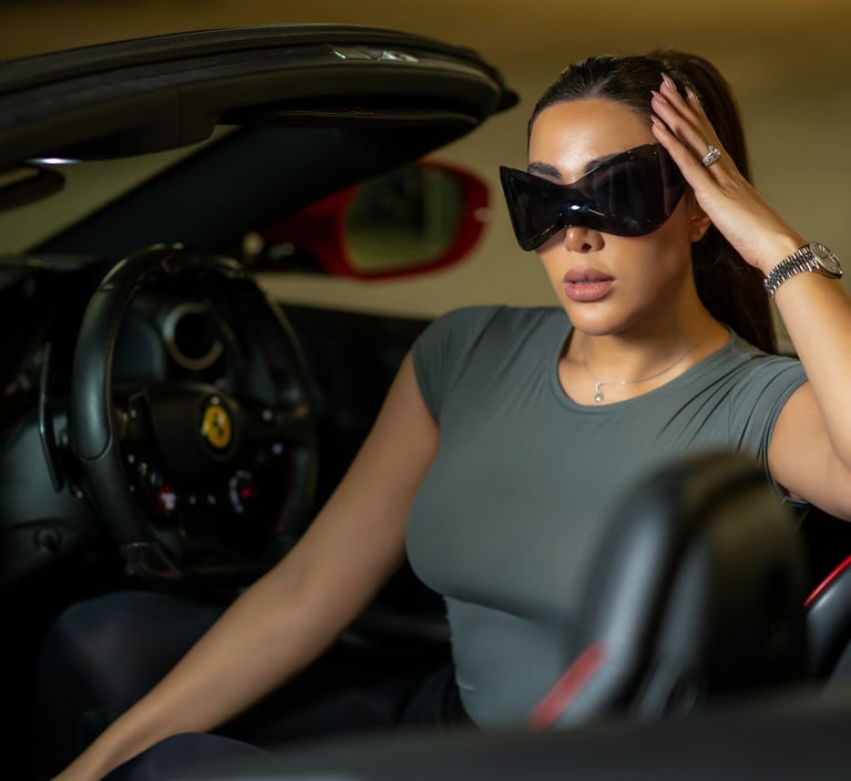 Close-up of model wearing sunglasses inside luxury car, captured by Fred Art Studio.