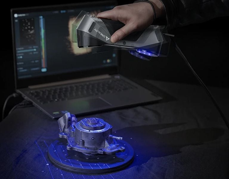 car part being 3d scanned with a blue laser