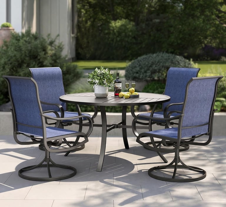 A 5-piece outdoor dining set with a round metal table and four blue swivel chairs on a garden patio.