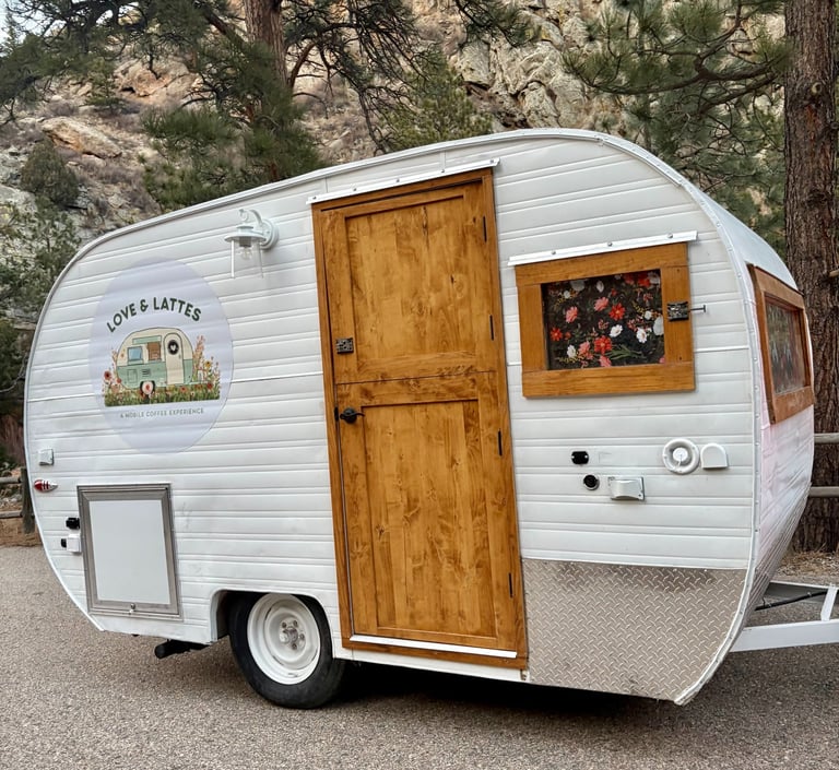Love & Lattes vintage mobile coffee trailer at an outdoor event in Northern Colorado