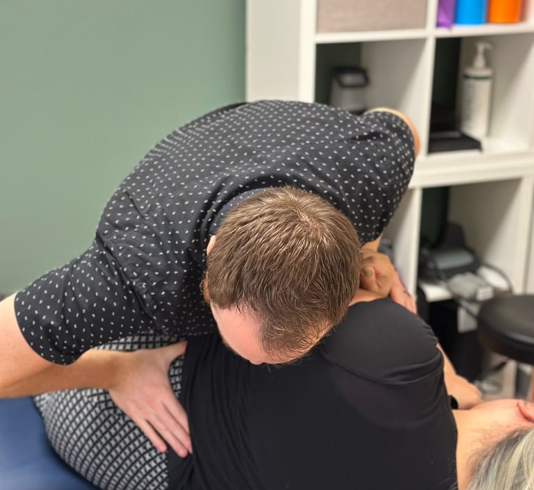 Dr. Frost giving a low back adjustment to patient in Royal Palm Beach FL