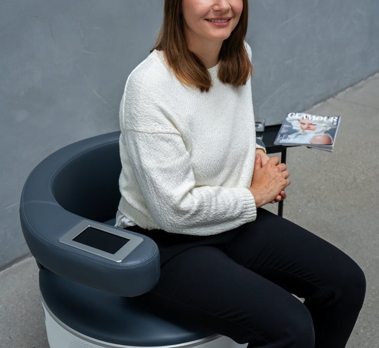 a woman sitting in a chair with a magazine on it