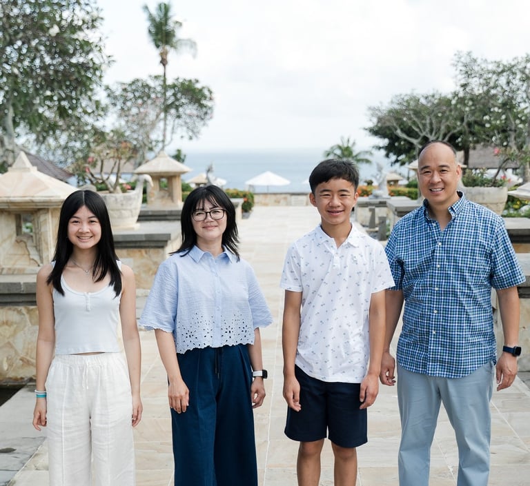 Simple and clean family portrait with natural light during a relaxed session at Ayana Resort Jimbaran Bali