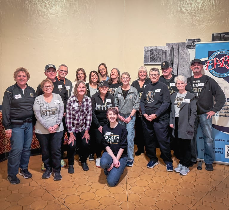 A group of volunteers smiling together for a group photo