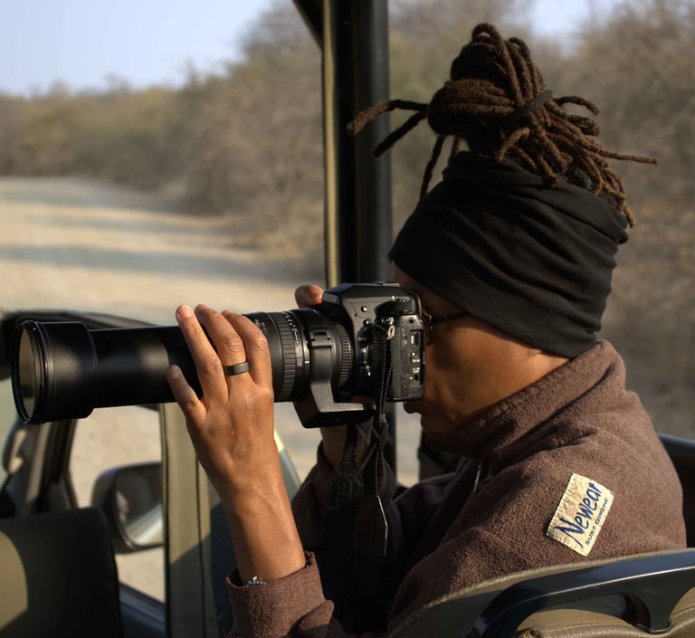 Guest on safari photographing iconic African wildlife