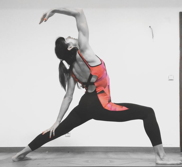 a woman in a sports bra top doing yoga