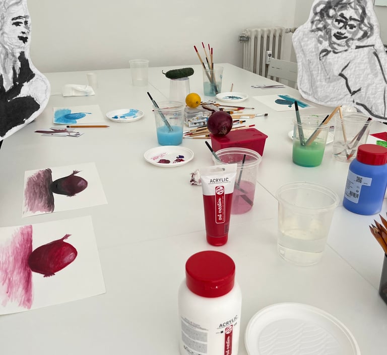 small group art class focused drawing session Turin