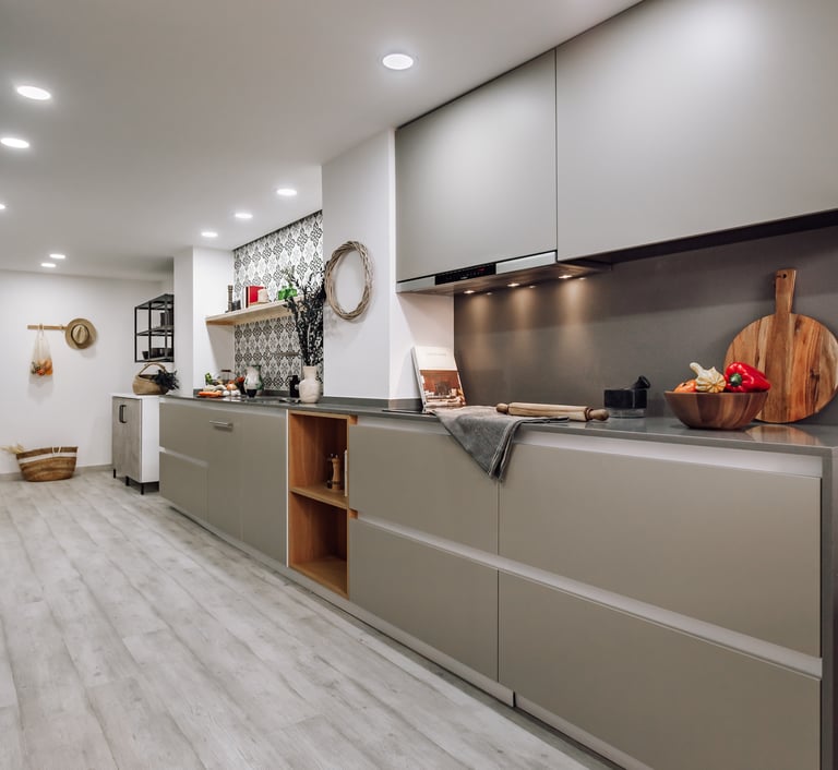 Open-plan kitchen with patterned tiles, neutral tones in Rute apartment interior design