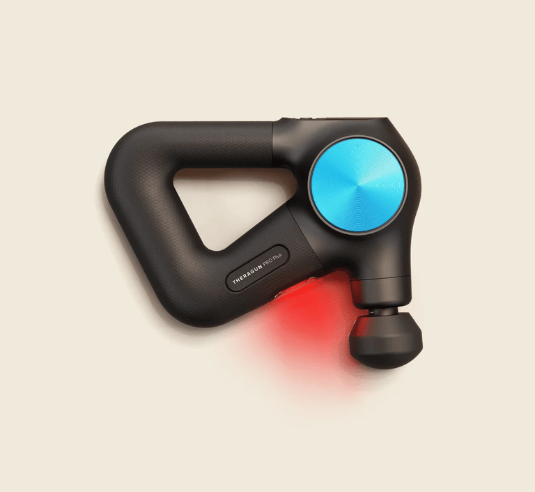Theragun Pro Plus massage gun with heat therapy attachment for deep muscle and lower back recovery