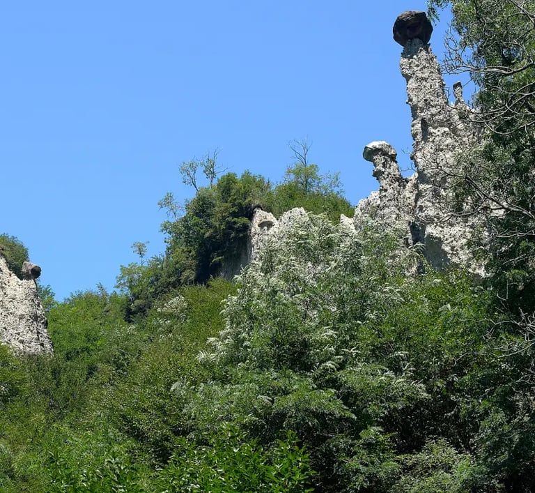 Earth Pyramids of Zone, tall stone spires capped with boulders near Lake Iseo