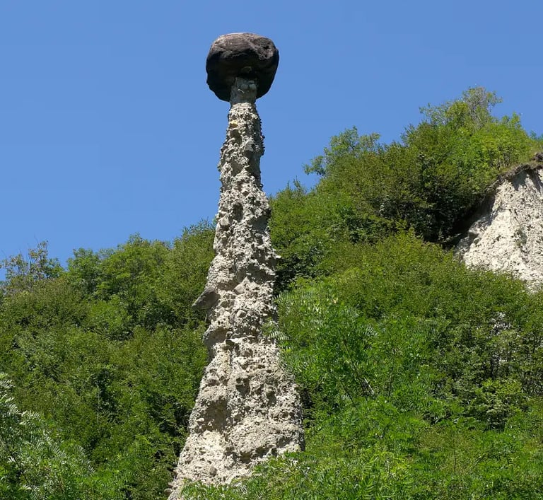 Earth Pyramids of Zone, tall stone spires capped with boulders near Lake Iseo