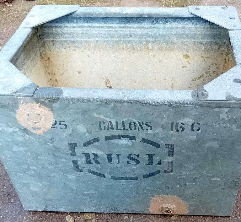 Old rectangular galvanised steel cold water tank