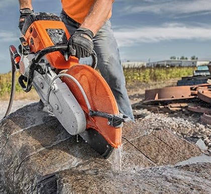  Using a cut off machine to cut stone