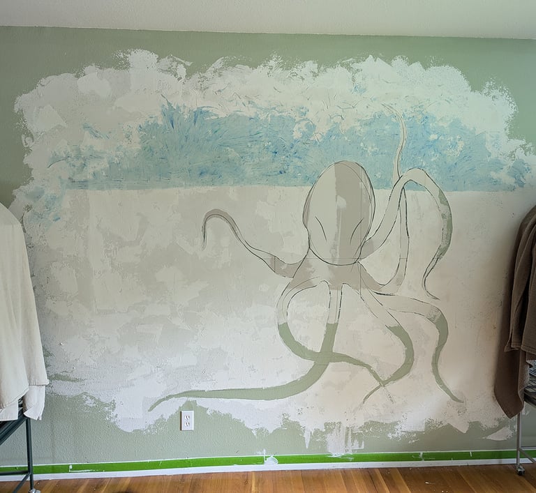 Creating a 3D relief wall mural with joint compound while mixing chalk pastel dust into the compound for color and affect.