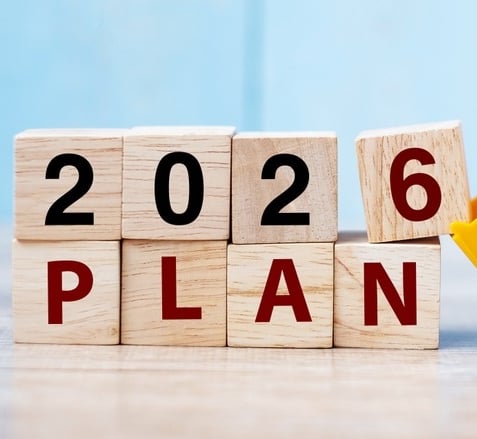 a toy truck with a dump truck in the background