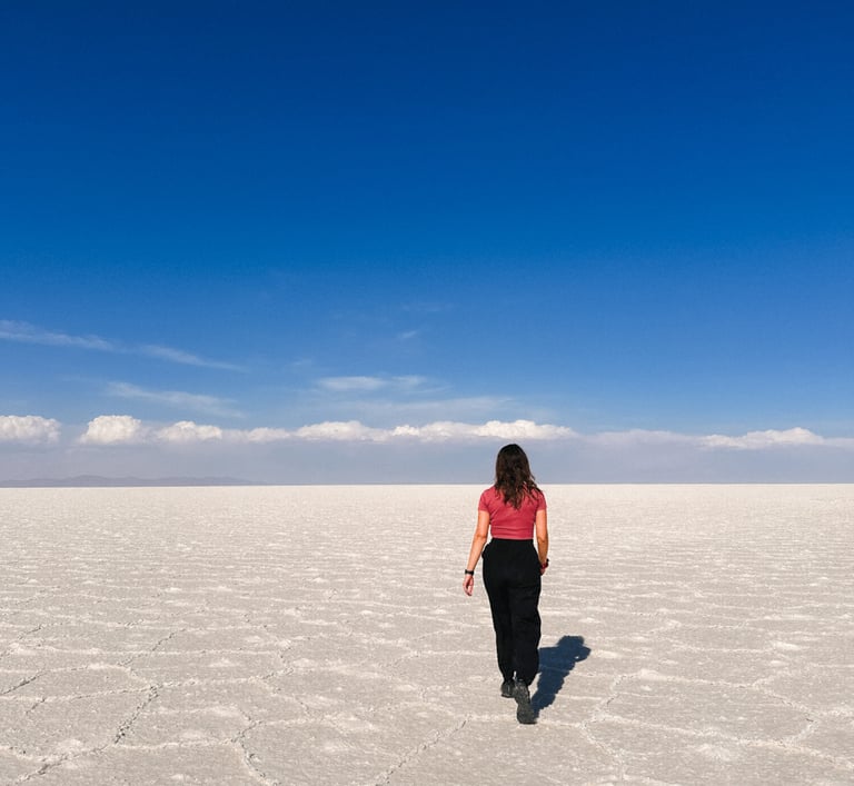 Girl in Salar de Uyuni, salt desert in Bolivia, South America