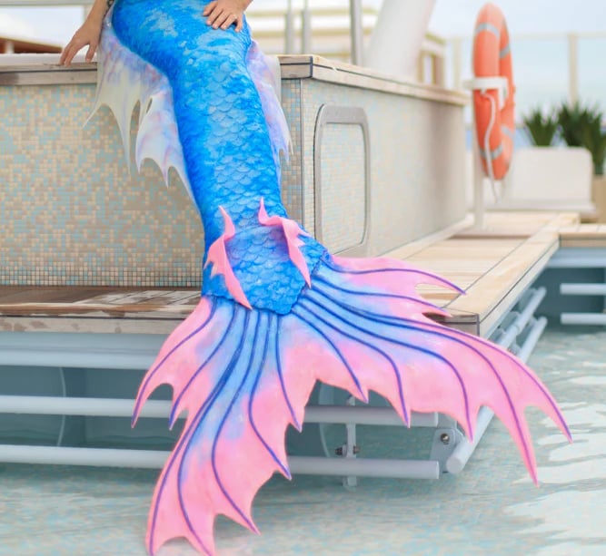 A pink and blue tail by Mermaid Kat, with pink ankle fins and translucent blue hip fins.