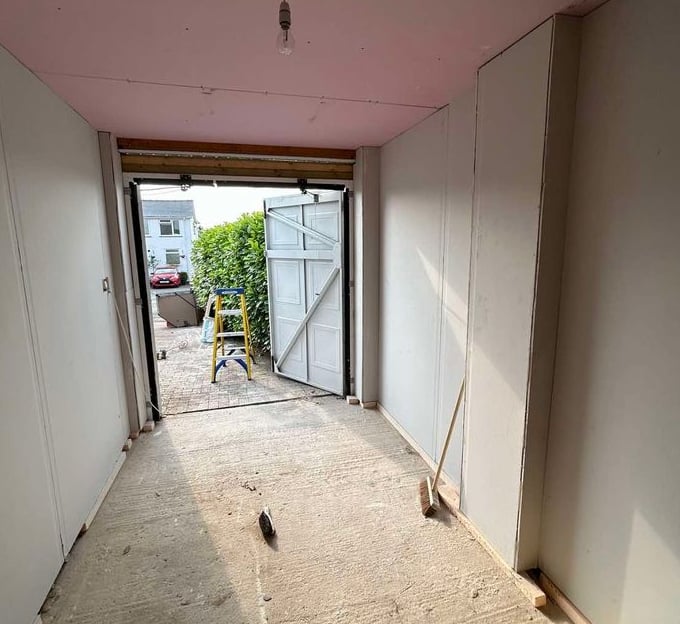 Plasterboard installation on a living room ceiling by Franklins Plastering in Worcester.