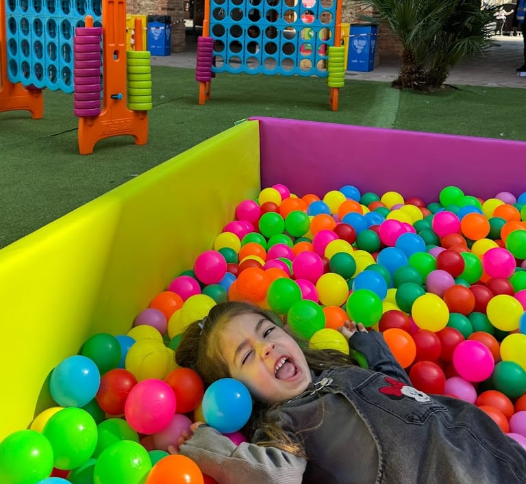 a child's play area with a ball pit in petit brunch in barcelona