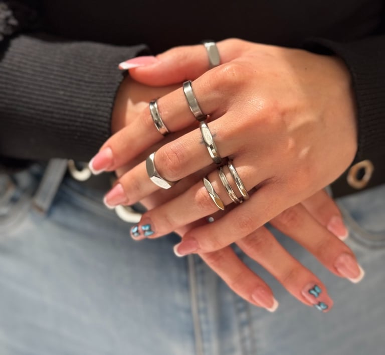 a woman's hands with rings on her fingers