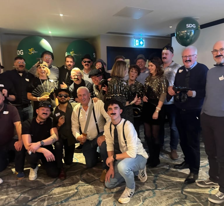 a group of corporate people enjoy a murder mystery party