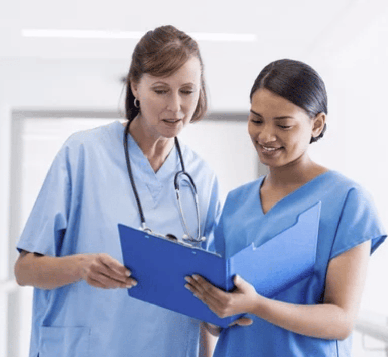 Two nurses working collaboratively. 