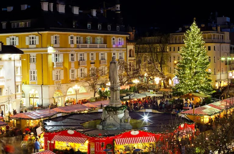 Walther Square in Bolzano with Christmas tree, festive stalls, and holiday lights