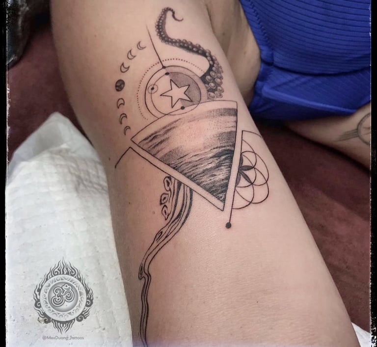Fineline tattoo with ocean symbols like waves, octopus, and a Vietnamese star