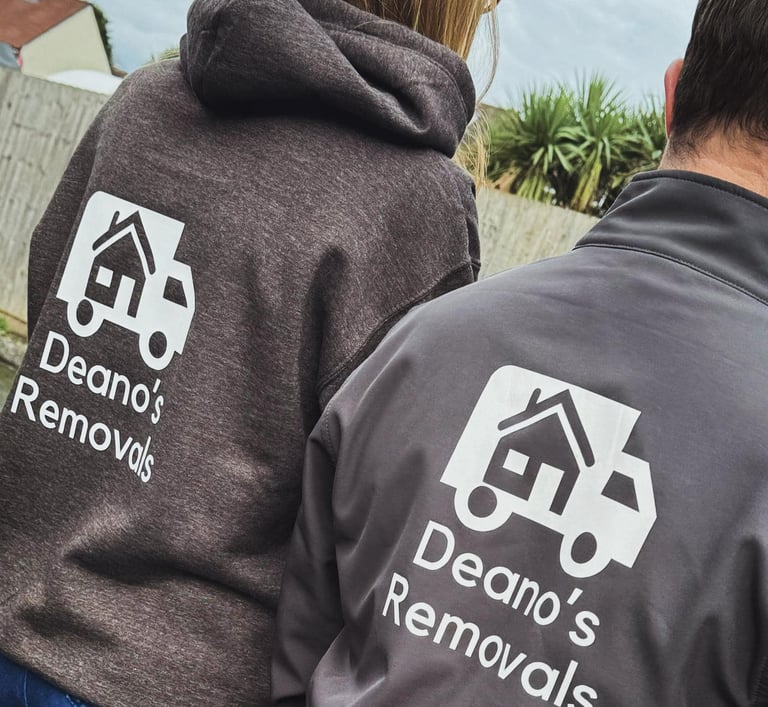 2 deanos removals workers wearing grey company jumpers with their logo