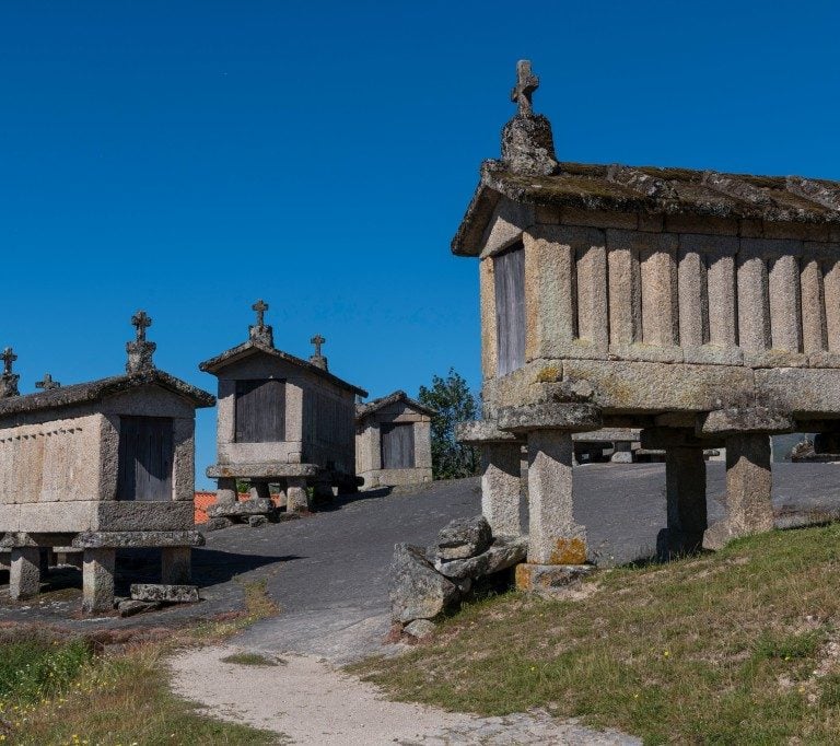 a stone building with a stone wall and a stone wall