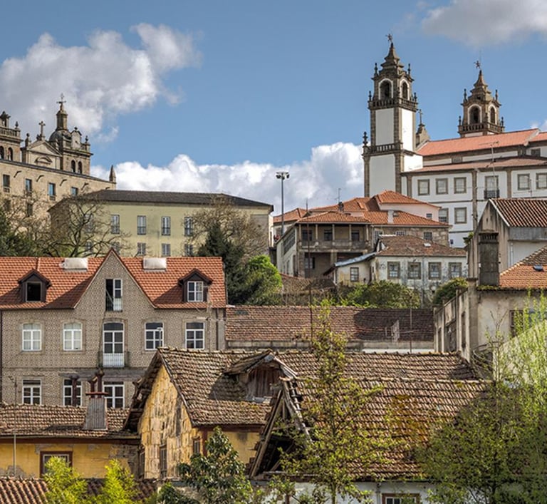a city with a lot of buildings and a clock tower