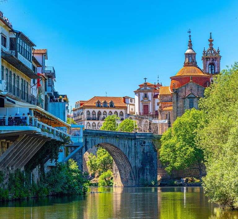 a bridge over a river with a bridge in the background