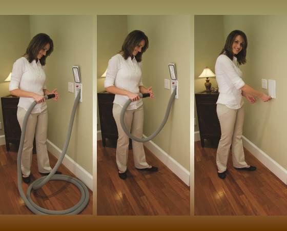 a woman is using a vacuum cleaner to clean her house