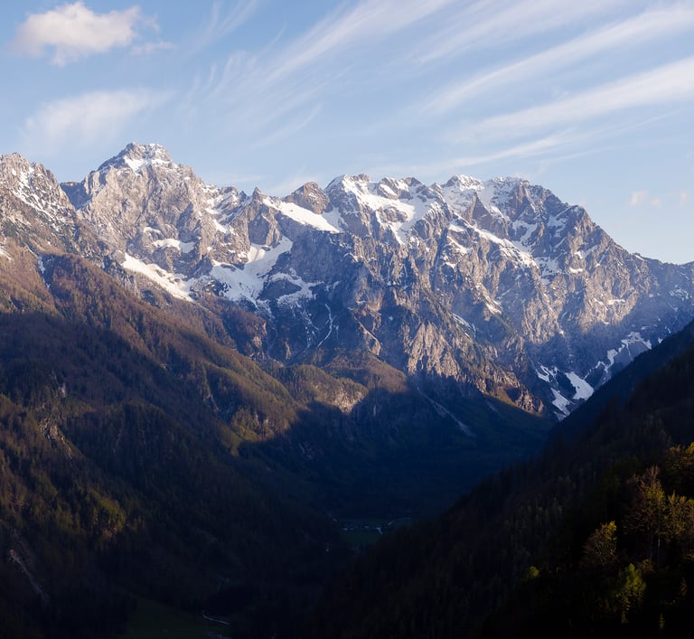 a mountain scene with a view of a valley