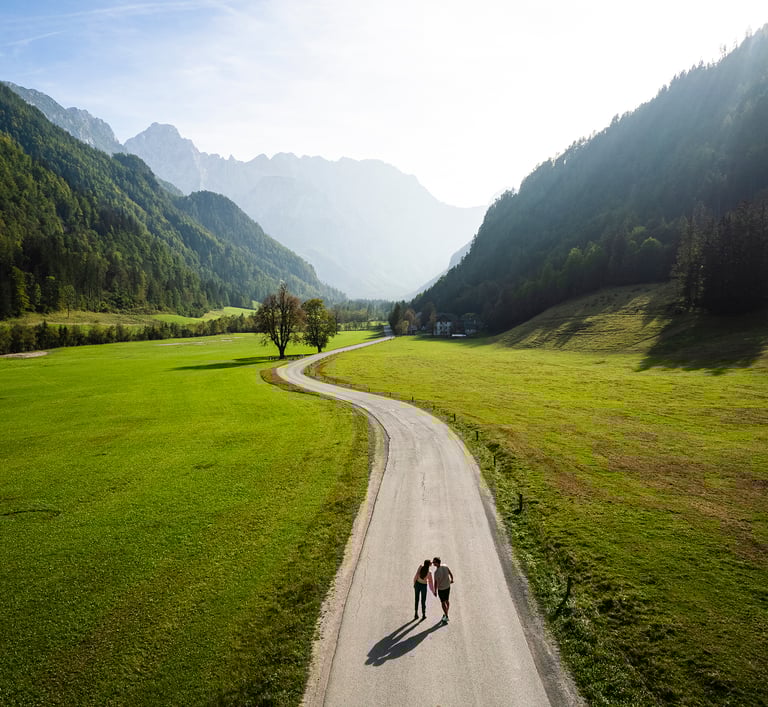 a person riding a bike down a road