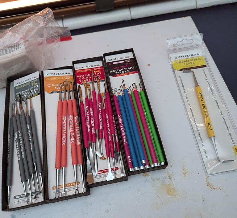 XIEM sculpting tools for clay and relief mural art.