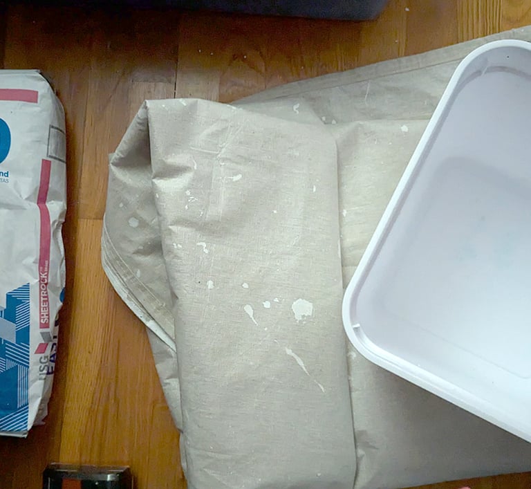 3D relief mural essentials to start; EasySand 90, large waterproof floor painting tarp, and a square bucket.