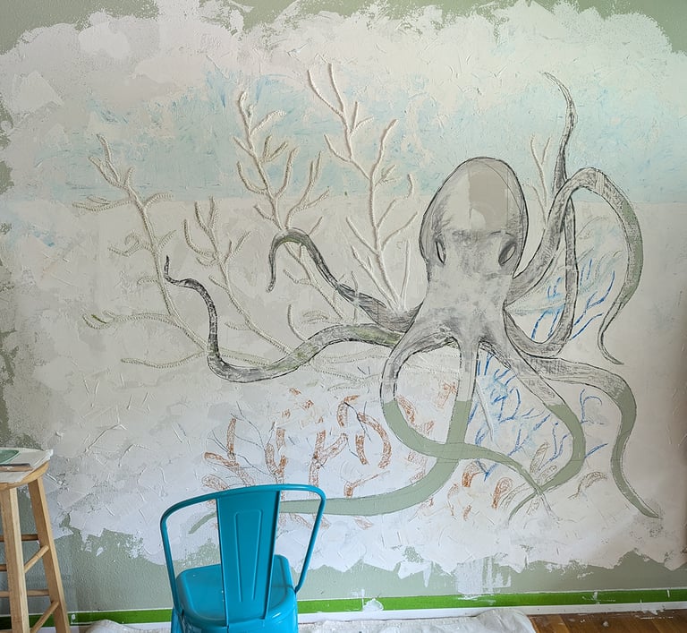 Interior relief mural using joint compound. Octopus in his garden. Sketching in colored pastels on the joint compound .