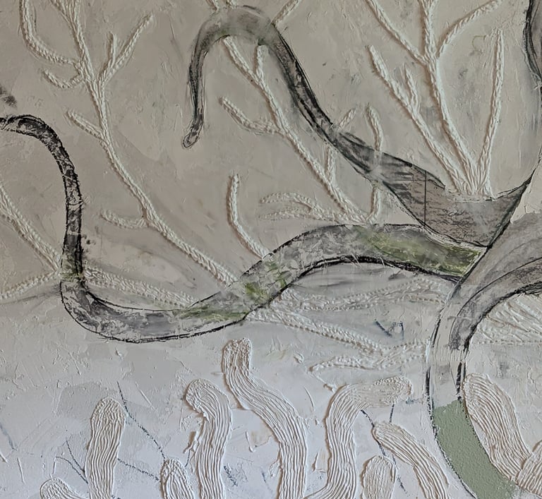 Close up photo of a relief mural being made with joint compound. Sculpting and building up thickness with EasySand 90.