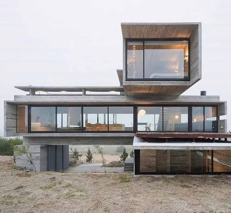 Livorohaus modern villa house with a large glass window and a view of the ocean