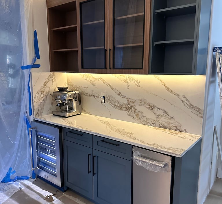 Open-concept kitchen renovation featuring island installation, pendant lighting, and custom cabinetr