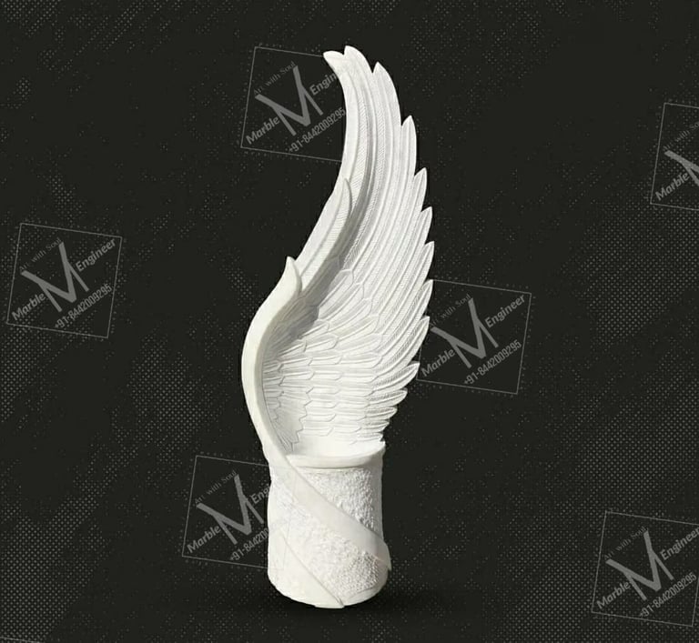 a white angel wing sculpture on a black background