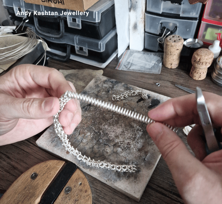 a person is holding a chainmaill and a chainmaille